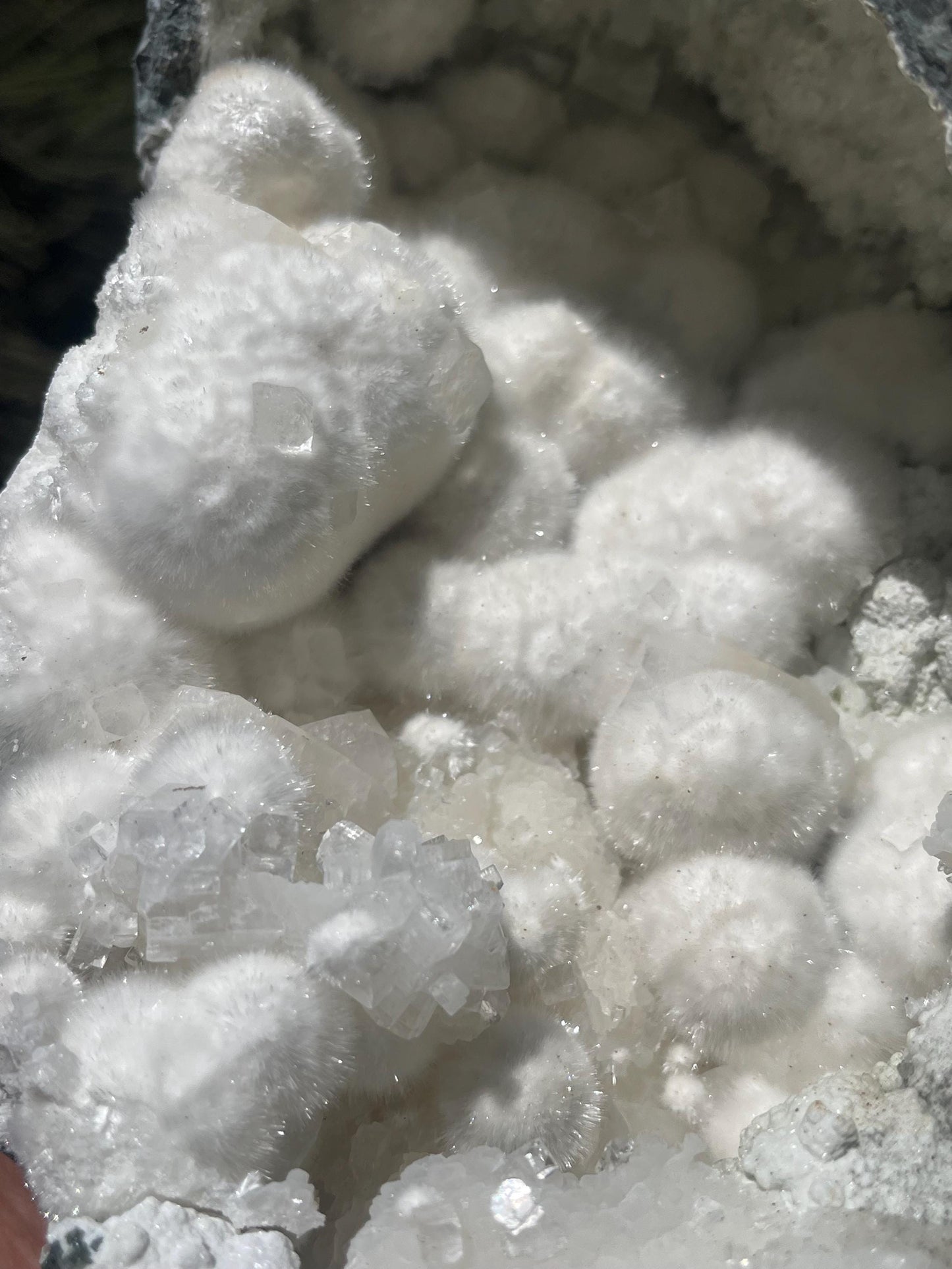 okenite big puffs balls on apophyllite inside geode