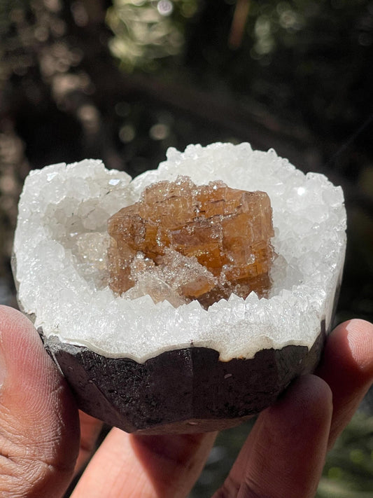 natural brown calcite crystal on quartz