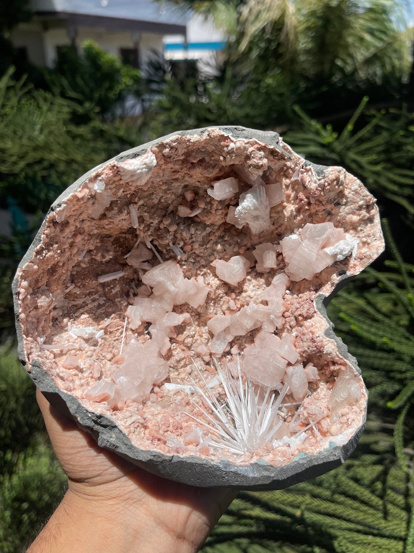 Scolecite spray inside orange heulandite geode