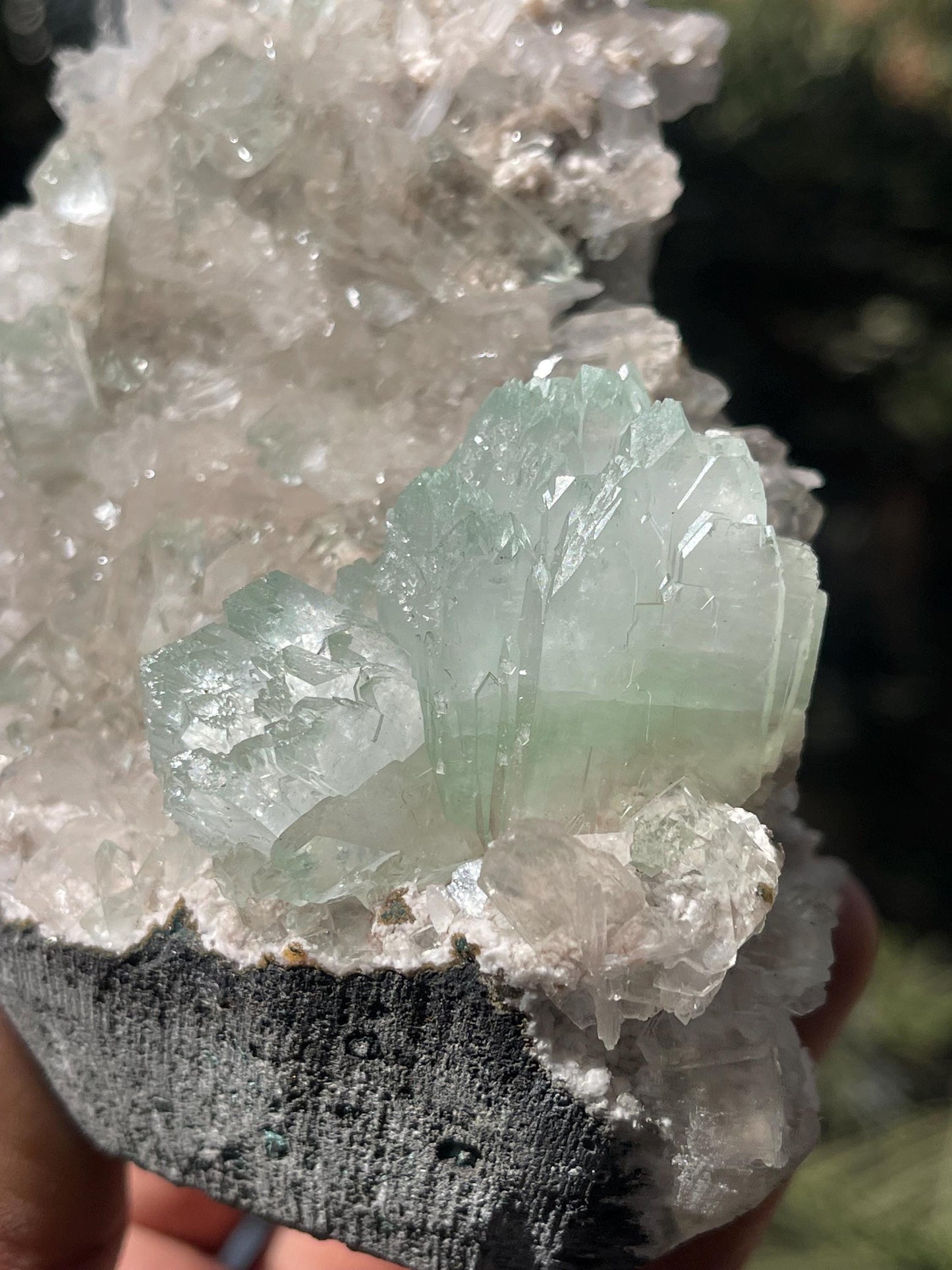 green apophyllite flower with small stilbite on chalcedony matrix