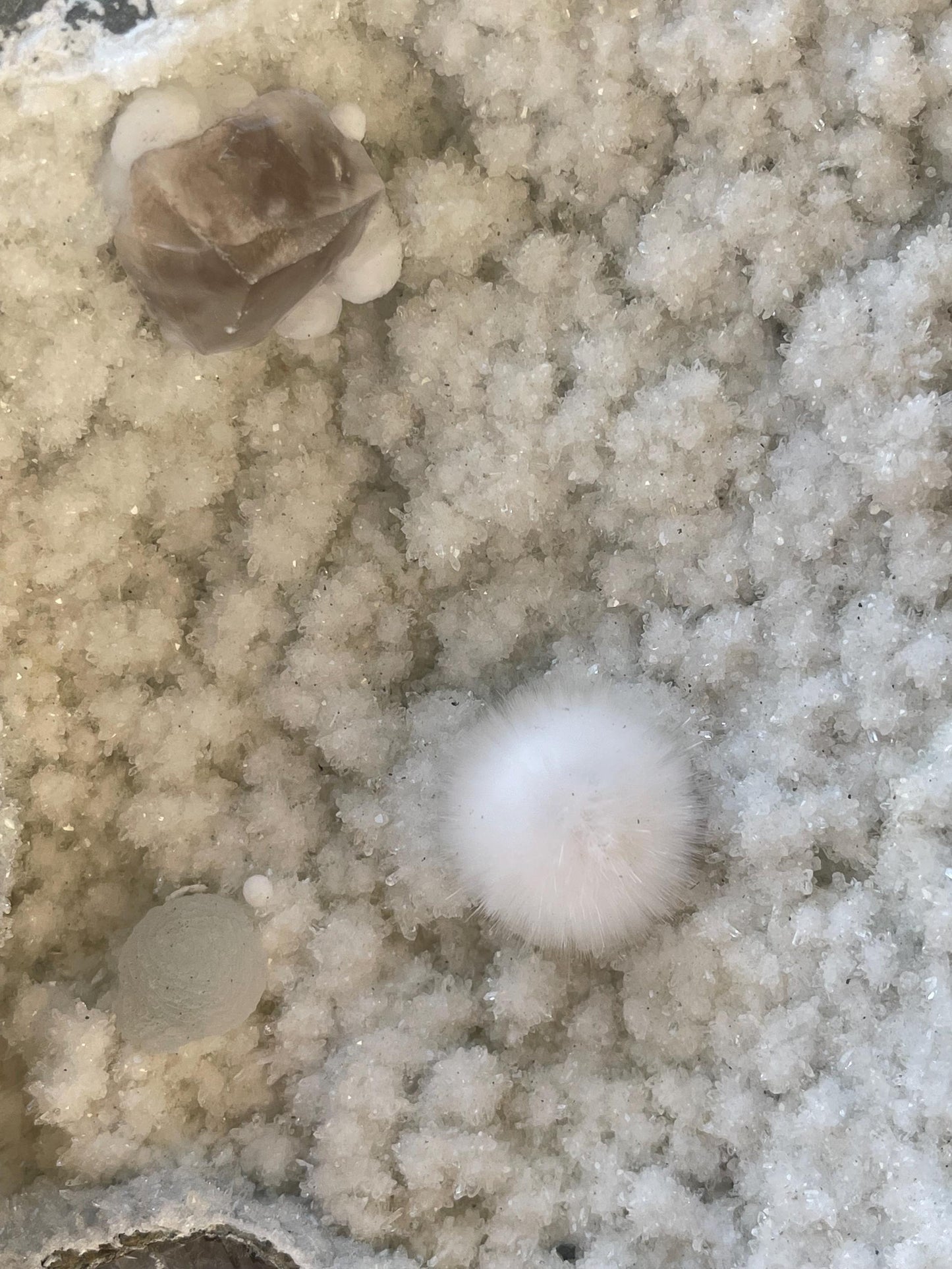 combination of okenite calcite gyrolite on white chalcedony matrix