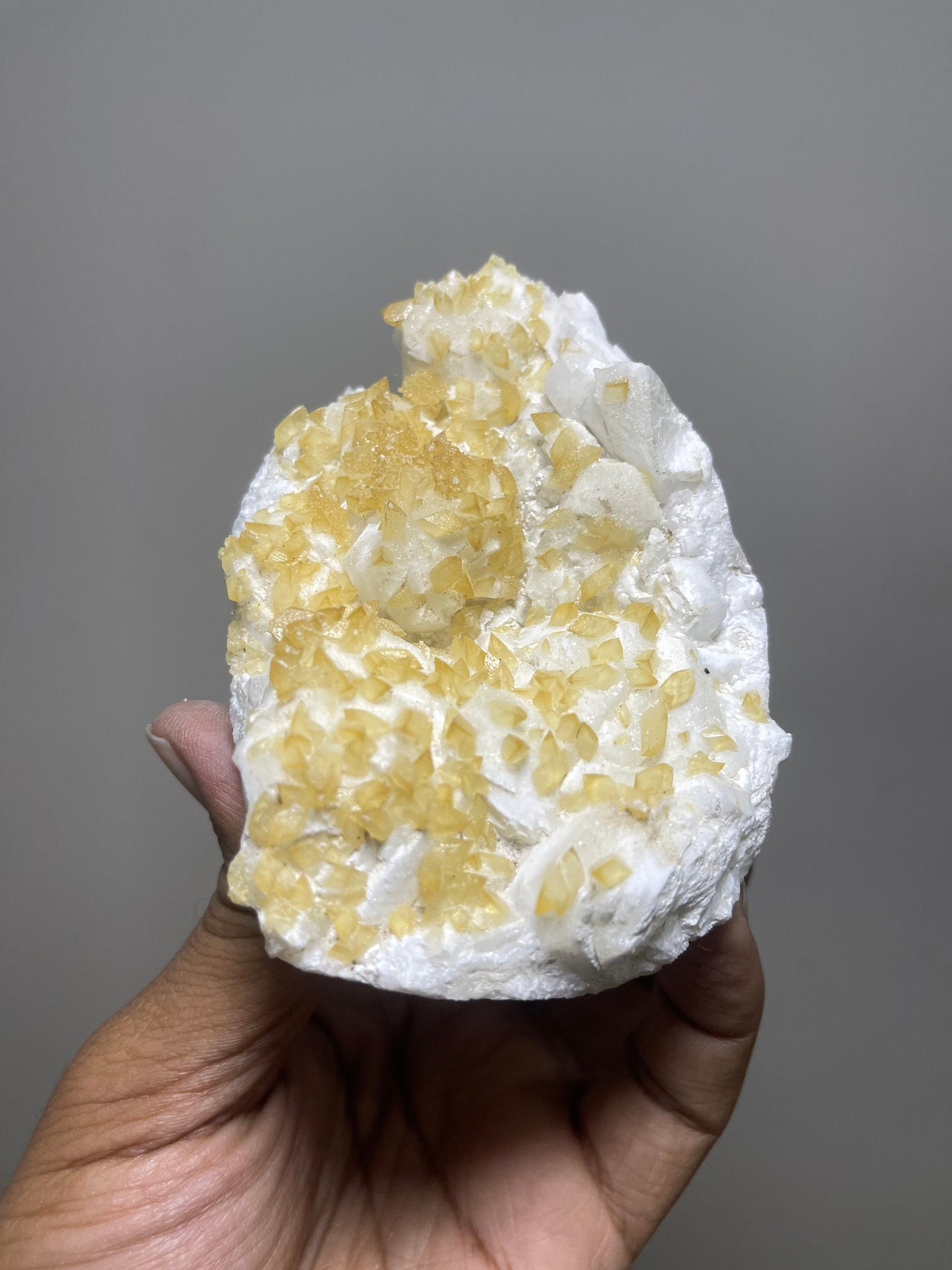 Rare find ..! Golden calcite  crystal on white apophyllite