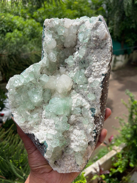 Green apophyllite crystal on white chalcedony matrix