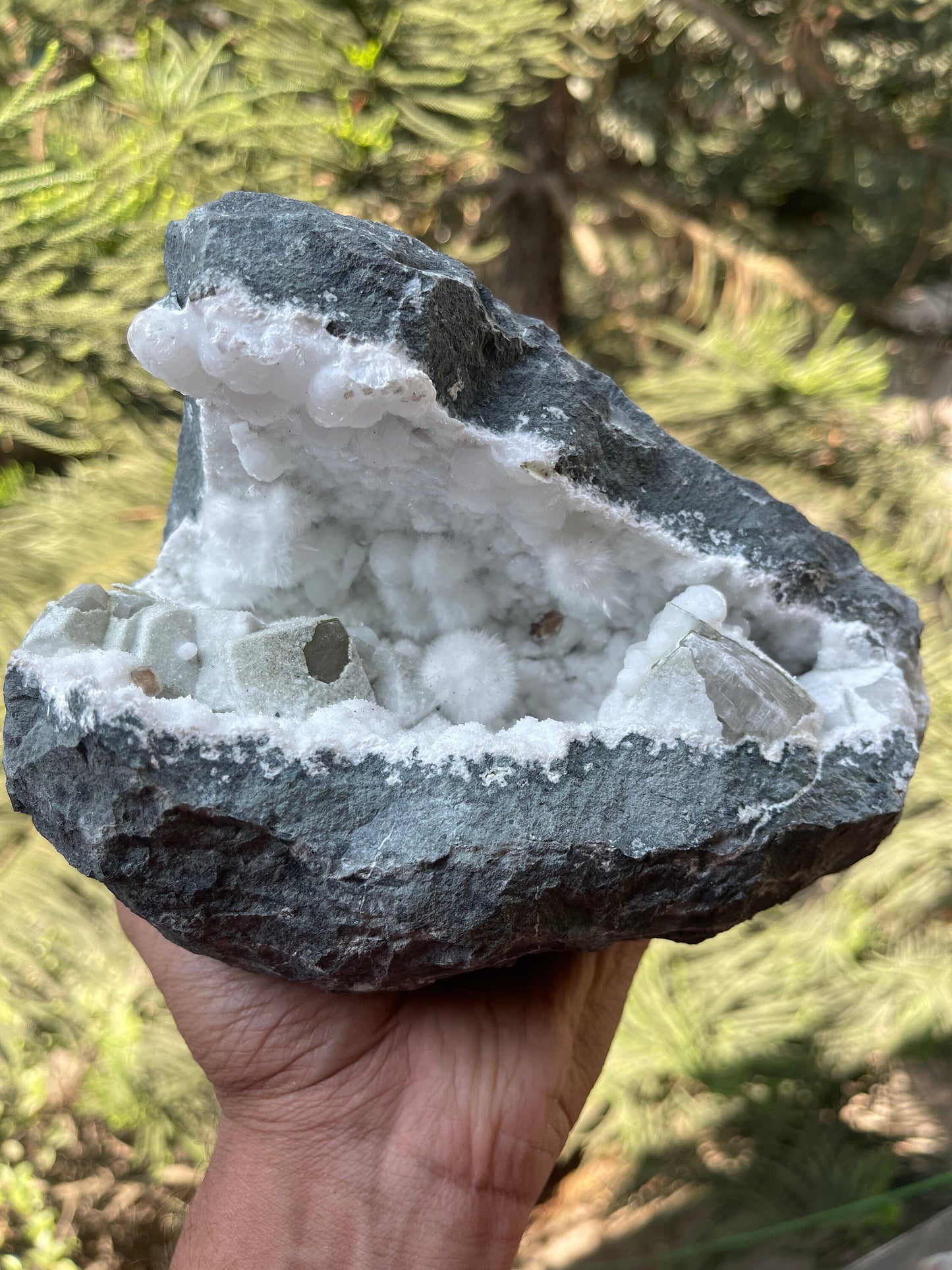 Okenite balls with calcite natural mineral geode