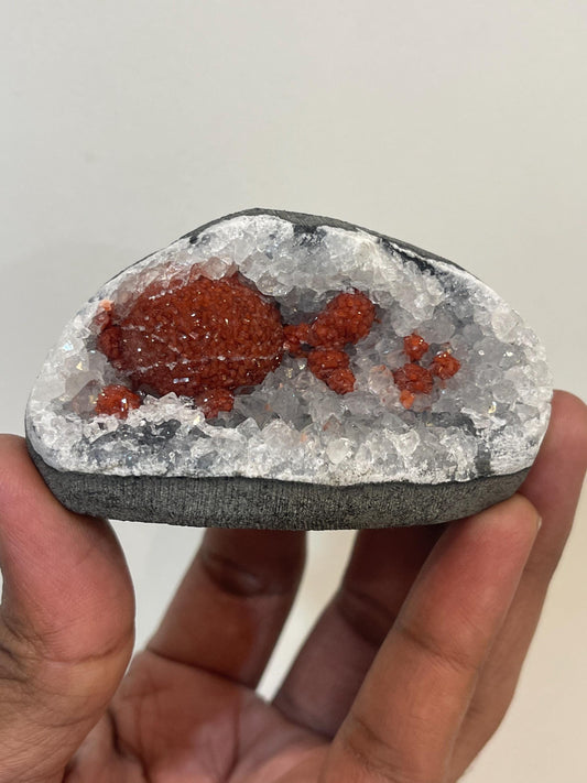 Rare find .. Red fluoride ball on blue quartz crystal
