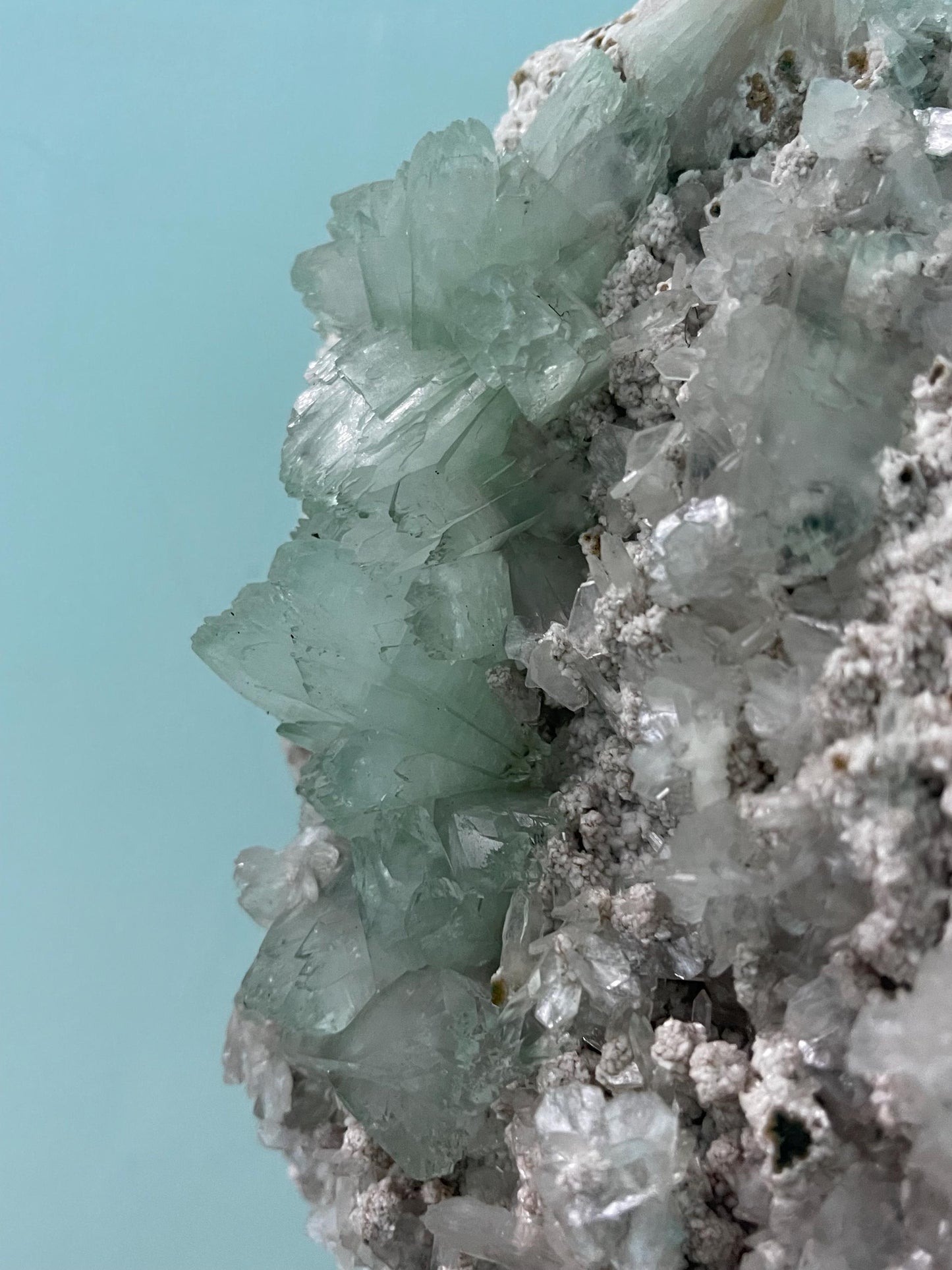 light green apophyllite crystal flower on white chalcedony matrix with stilbite