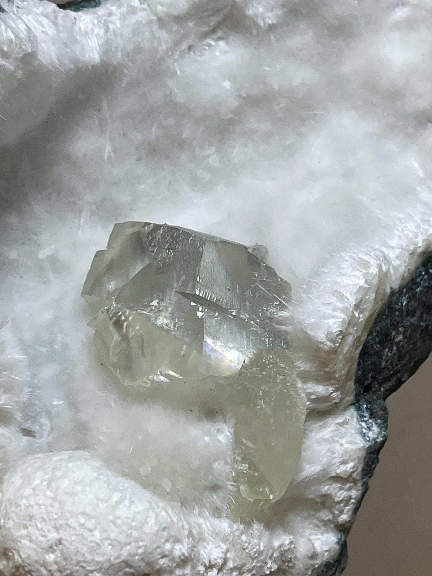 rare find, transparent calcite crystal on okenite matrix