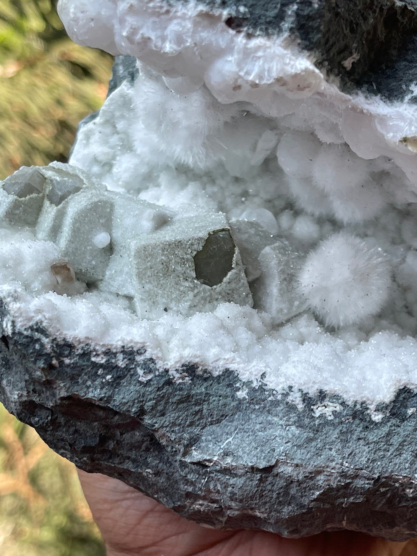 Okenite balls with calcite natural mineral geode