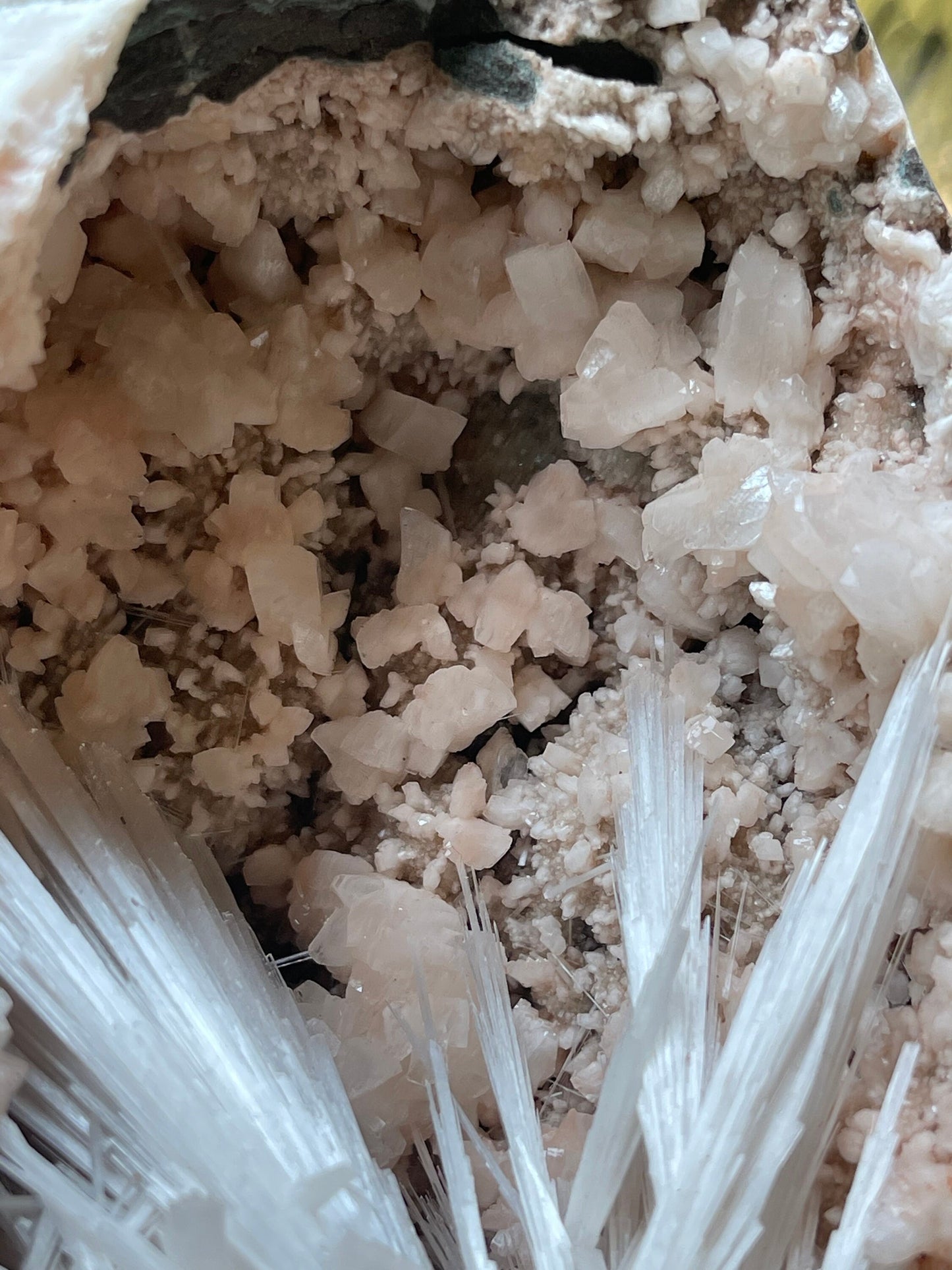 Scolecite spray with orange heulandite crystals inside geode natural specimen